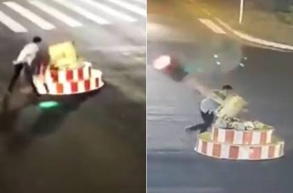 Impatient driver gets out of his car, takes down traffic light