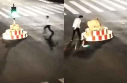 impatient man takes down traffic light